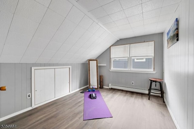 46 Sunrise Ter, Cedar Grove Twp, NJ 07009 - workout room featuring baseboard heating, wood finished floors, baseboards, and lofted ceiling