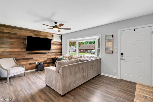 46 Sunrise Ter, Cedar Grove Twp, NJ 07009 - living area featuring wood finished floors, wooden walls, a ceiling fan, and baseboards