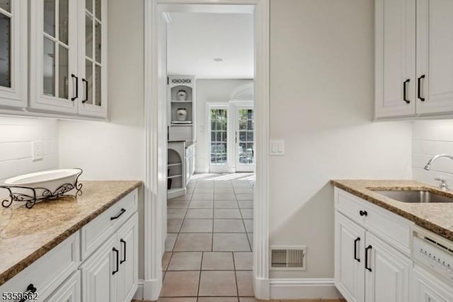 23 Stoningham Dr, Warren Twp, NJ 07059 - bar area featuring a sink, tasteful backsplash, and light tile patterned floors