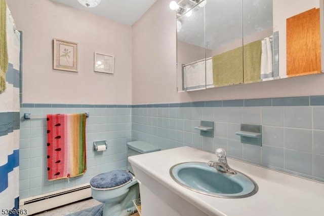 580 Eric Ln, Mount Arlington Boro, NJ 07850 - full bathroom featuring a baseboard heating unit, toilet, tile walls, vanity, and a wainscoted wall