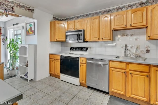 580 Eric Ln, Mount Arlington Boro, NJ 07850 - kitchen featuring appliances with stainless steel finishes, a sink, tasteful backsplash, and light countertops