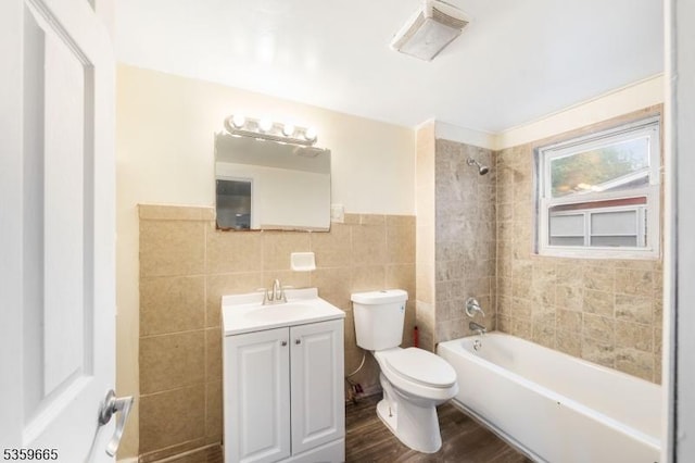 28 Beechwood Pl, Irvington Twp, NJ 07111 - full bath featuring tile walls, toilet, vanity, wood finished floors, and tub / shower combination