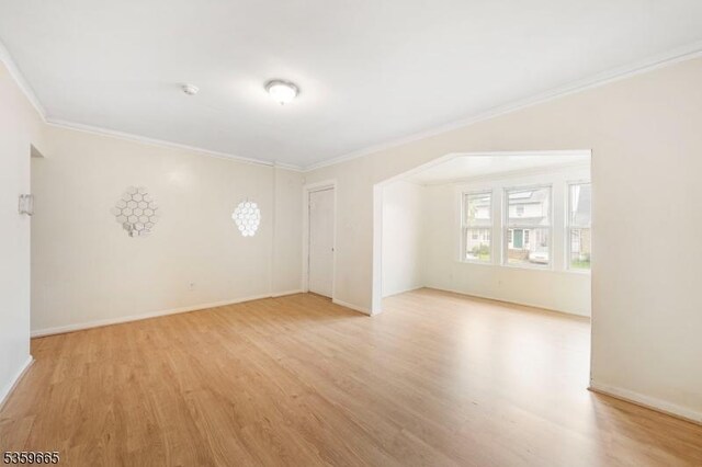 28 Beechwood Pl, Irvington Twp, NJ 07111 - unfurnished room with light wood-type flooring, ornamental molding, baseboards, and a smoke detector