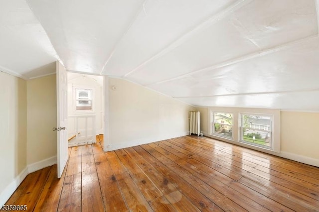 28 Beechwood Pl, Irvington Twp, NJ 07111 - bonus room with radiator heating unit, hardwood / wood-style flooring, lofted ceiling, and baseboards