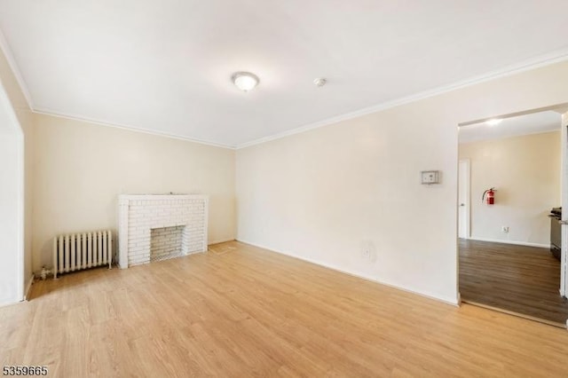 28 Beechwood Pl, Irvington Twp, NJ 07111 - unfurnished living room featuring radiator, crown molding, wood finished floors, and a fireplace