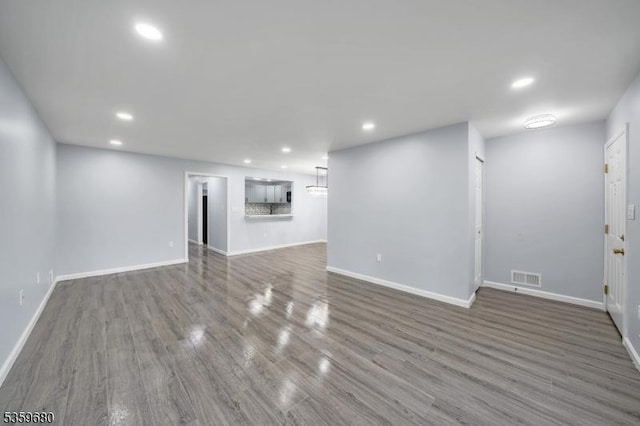 173 Gregory Ln, Franklin Twp, NJ 08823 - unfurnished living room with wood finished floors, baseboards, and recessed lighting