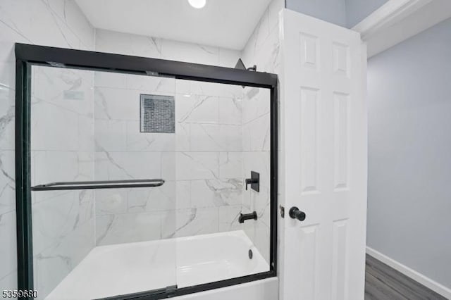 173 Gregory Ln, Franklin Twp, NJ 08823 - full bath with shower / bath combination with glass door, baseboards, and wood finished floors