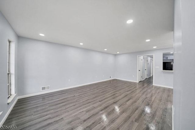 173 Gregory Ln, Franklin Twp, NJ 08823 - unfurnished living room featuring wood finished floors, baseboards, and recessed lighting