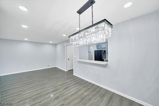 173 Gregory Ln, Franklin Twp, NJ 08823 - unfurnished living room with wood finished floors, baseboards, and recessed lighting