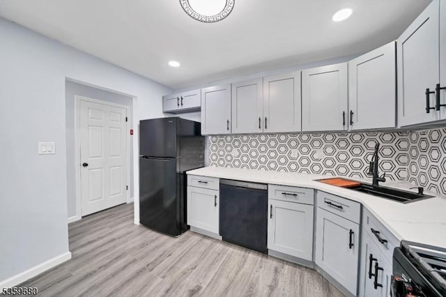 173 Gregory Ln, Franklin Twp, NJ 08823 - kitchen with black appliances, tasteful backsplash, recessed lighting, light wood-type flooring, and baseboards