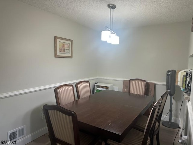 167 Rachel Ct, Franklin Twp, NJ 08823 - dining room featuring a textured ceiling and baseboards