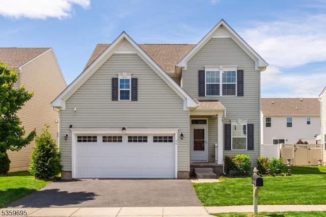 76 Trafalgar Ct, Sparta Twp, NJ 07871 - traditional-style home featuring asphalt driveway and an attached garage