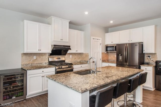 76 Trafalgar Ct, Sparta Twp, NJ 07871 - kitchen featuring beverage cooler, appliances with stainless steel finishes, a sink, dark wood-style floors, and recessed lighting