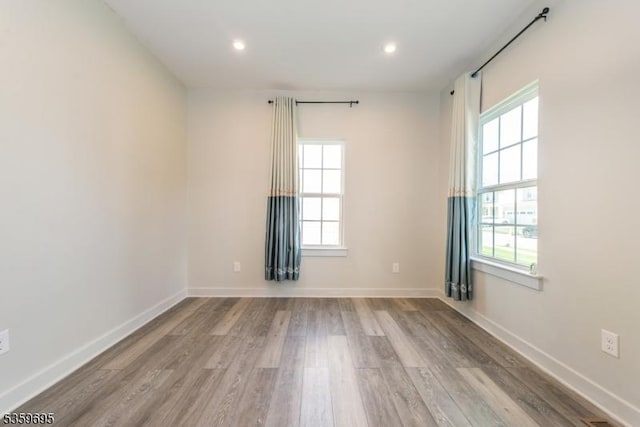 76 Trafalgar Ct, Sparta Twp, NJ 07871 - empty room featuring healthy amount of natural light, wood finished floors, recessed lighting, and baseboards