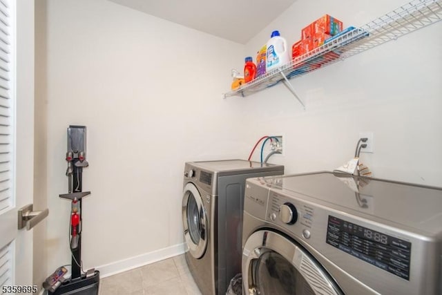 76 Trafalgar Ct, Sparta Twp, NJ 07871 - laundry room with separate washer and dryer, light tile patterned floors, and baseboards