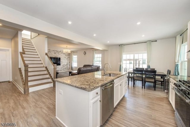 76 Trafalgar Ct, Sparta Twp, NJ 07871 - kitchen featuring stainless steel appliances, a sink, light wood-style floors, white cabinetry, and recessed lighting