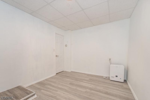 76 Trafalgar Ct, Sparta Twp, NJ 07871 - empty room featuring light wood-style floors, a drop ceiling, and baseboards
