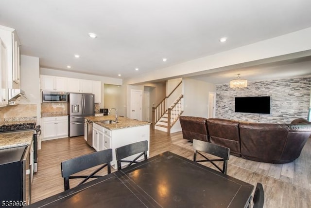76 Trafalgar Ct, Sparta Twp, NJ 07871 - dining area with light wood-style floors, stairway, and recessed lighting