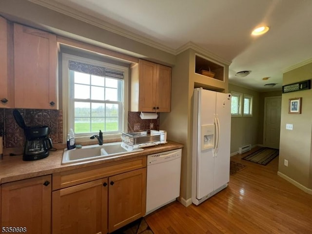 134 Lott Rd, Wantage Twp, NJ 07461 - kitchen with white appliances, a sink, a baseboard heating unit, backsplash, and ornamental molding