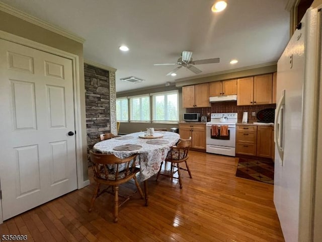 134 Lott Rd, Wantage Twp, NJ 07461 - kitchen featuring white appliances, under cabinet range hood, crown molding, hardwood / wood-style flooring, and recessed lighting