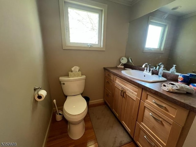 134 Lott Rd, Wantage Twp, NJ 07461 - half bathroom with crown molding, toilet, vanity, wood finished floors, and baseboards