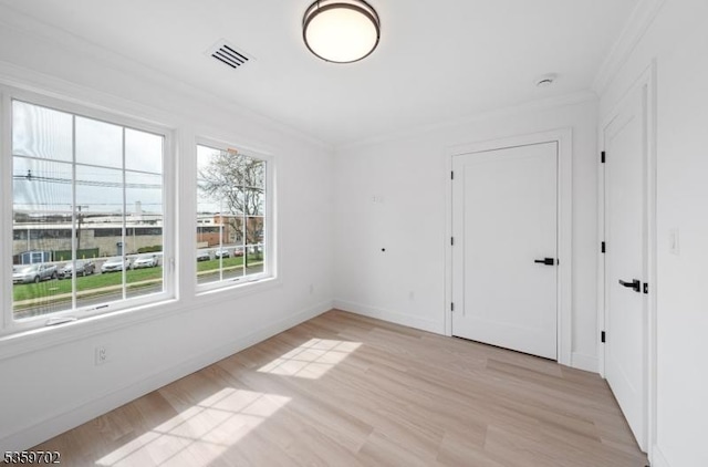 107 Myrtle St, Cranford Twp, NJ 07016 - spare room with light wood-style flooring, crown molding, and baseboards