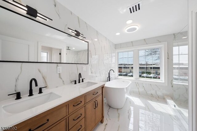 107 Myrtle St, Cranford Twp, NJ 07016 - full bath with tile walls, a soaking tub, double vanity, marble tiled floors, and a marble finish shower