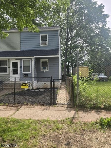 28 Ludlow St, Newark City, NJ 07114 - view of front of house featuring a fenced front yard, a gate, and roof with shingles