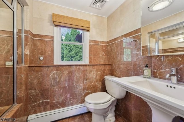 1 Spring Garden Dr, Madison Boro, NJ 07940 - bathroom featuring baseboard heating, tile walls, toilet, a sink, and a shower