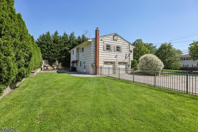1 Spring Garden Dr, Madison Boro, NJ 07940 - rear view of property with a garage, driveway, and a chimney