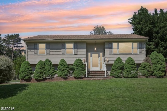 1 Spring Garden Dr, Madison Boro, NJ 07940 - raised ranch featuring a front lawn and entry steps