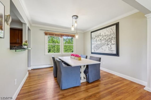 1 Spring Garden Dr, Madison Boro, NJ 07940 - dining area featuring a baseboard radiator, ornamental molding, wood finished floors, baseboards, and decorative columns