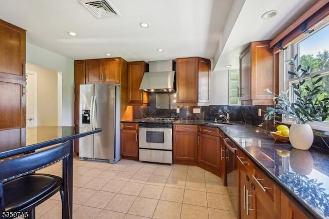 1 Spring Garden Dr, Madison Boro, NJ 07940 - kitchen featuring appliances with stainless steel finishes, wall chimney exhaust hood, a sink, backsplash, and brown cabinets