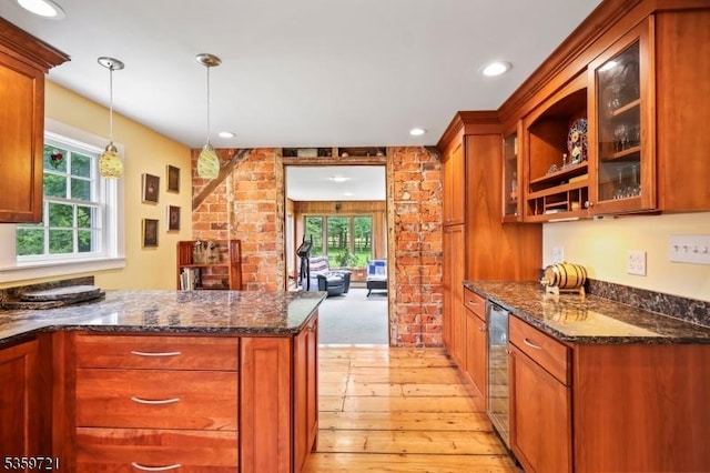 Rocky Hill Boro, NJ 08553 - kitchen with light wood-style flooring, healthy amount of natural light, glass insert cabinets, a peninsula, and recessed lighting