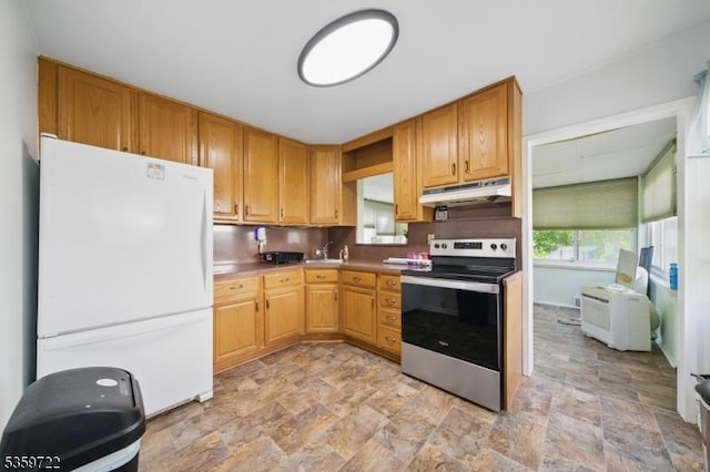 4 Erie Ave, Rockaway Twp, NJ 07866 - kitchen with freestanding refrigerator, stainless steel electric range oven, under cabinet range hood, stone finish floors, and a sink