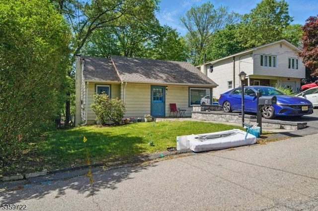4 Erie Ave, Rockaway Twp, NJ 07866 - bungalow featuring a front yard and covered porch