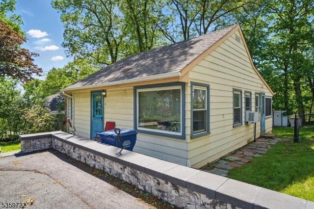 4 Erie Ave, Rockaway Twp, NJ 07866 - bungalow-style home with roof with shingles and cooling unit