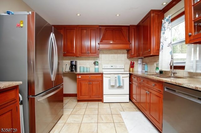 30 Acorn St, Byram Twp, NJ 07874 - kitchen with stainless steel appliances, custom range hood, a sink, light tile patterned floors, and decorative backsplash