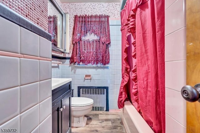 925 Stelle Ave, Plainfield City, NJ 07063 - full bathroom with radiator, toilet, wood finished floors, vanity, and tile walls