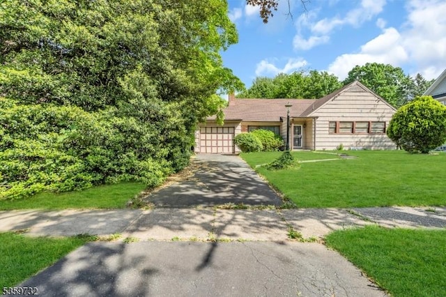 925 Stelle Ave, Plainfield City, NJ 07063 - view of front facade with driveway, an attached garage, a front lawn, and a chimney