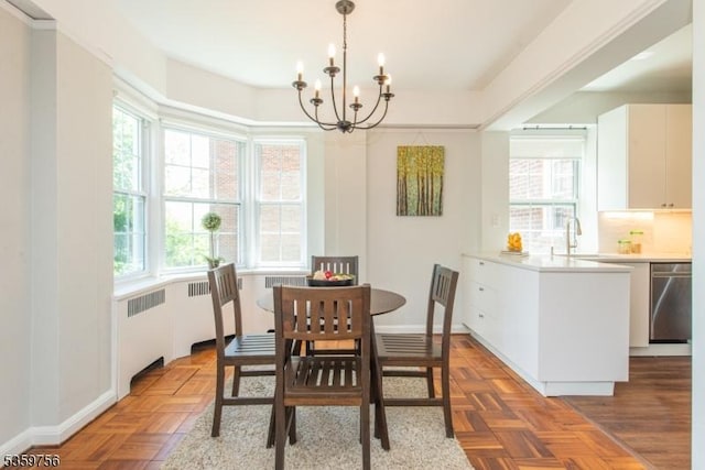 10 Crestmont Rd Unit 3F, Montclair Twp, NJ 07042 - dining room with radiator, a chandelier, and healthy amount of natural light