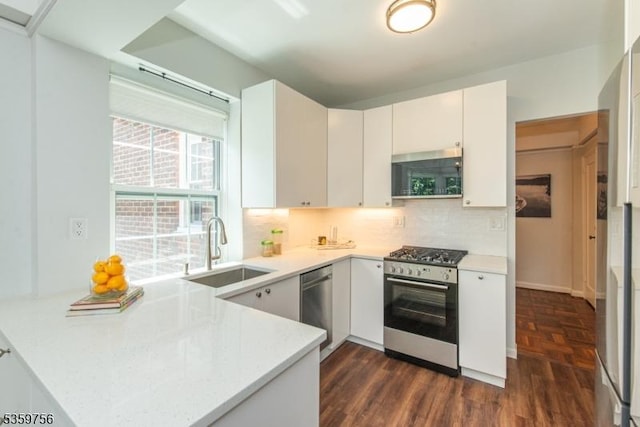 10 Crestmont Rd Unit 3F, Montclair Twp, NJ 07042 - kitchen with appliances with stainless steel finishes, a sink, light countertops, and a peninsula