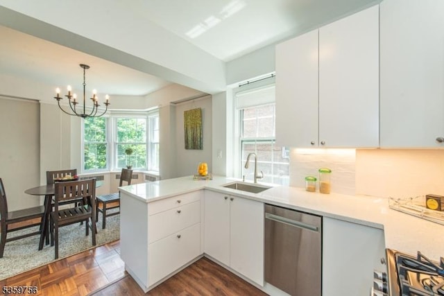 10 Crestmont Rd Unit 3F, Montclair Twp, NJ 07042 - kitchen featuring dishwasher, a sink, a peninsula, a chandelier, and light countertops