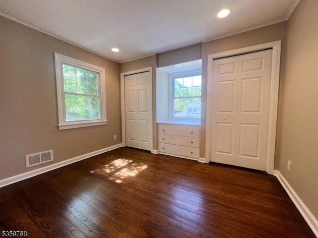 45 Park Ave, Newton Town, NJ 07860 - unfurnished bedroom with multiple closets, baseboards, dark wood-style flooring, ornamental molding, and recessed lighting