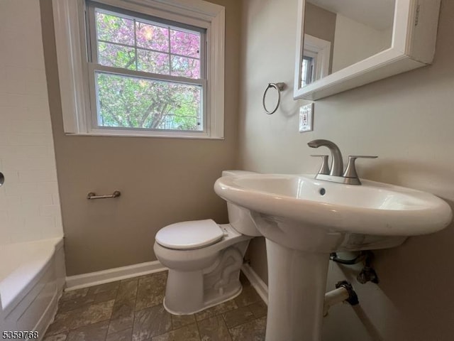 45 Park Ave, Newton Town, NJ 07860 - full bath with baseboards, healthy amount of natural light, toilet, and stone finish flooring