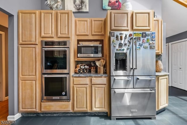1404 State Route 57, Mansfield Twp, NJ 07865 - kitchen featuring stainless steel appliances, decorative backsplash, dark tile patterned flooring, and light stone counters