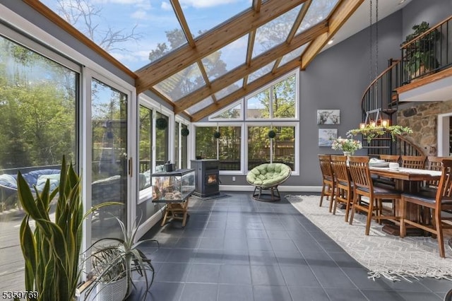 1404 State Route 57, Mansfield Twp, NJ 07865 - sunroom featuring a wood stove, healthy amount of natural light, tile patterned flooring, high vaulted ceiling, and beamed ceiling