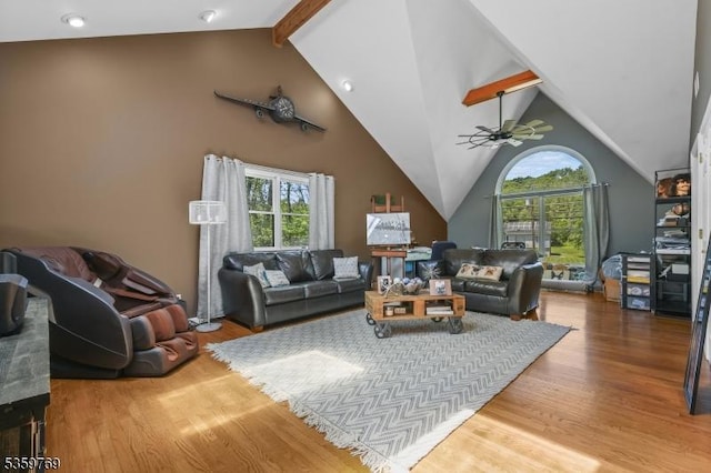 1404 State Route 57, Mansfield Twp, NJ 07865 - living room featuring plenty of natural light, wood finished floors, beam ceiling, a ceiling fan, and high vaulted ceiling