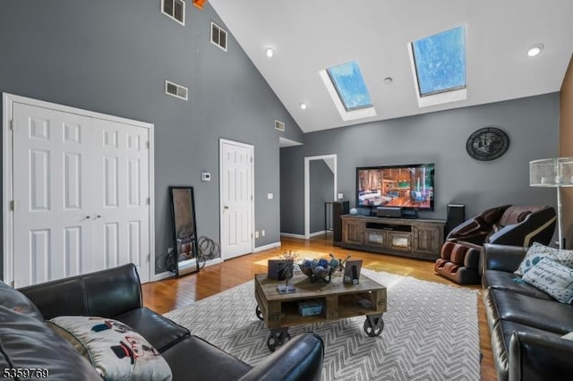 1404 State Route 57, Mansfield Twp, NJ 07865 - living room with high vaulted ceiling, a skylight, wood finished floors, baseboards, and recessed lighting