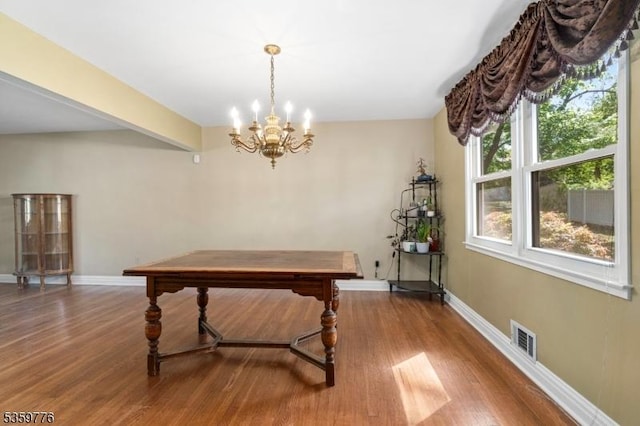185 Ann St, Dover Town, NJ 07801 - rec room with wood finished floors, a chandelier, and baseboards
